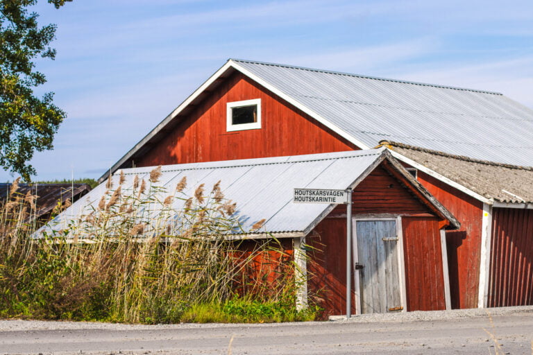 Red boat houses along the Archipelago Trail in Houtskär